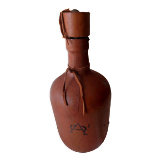 Bottle covered with leather with cap