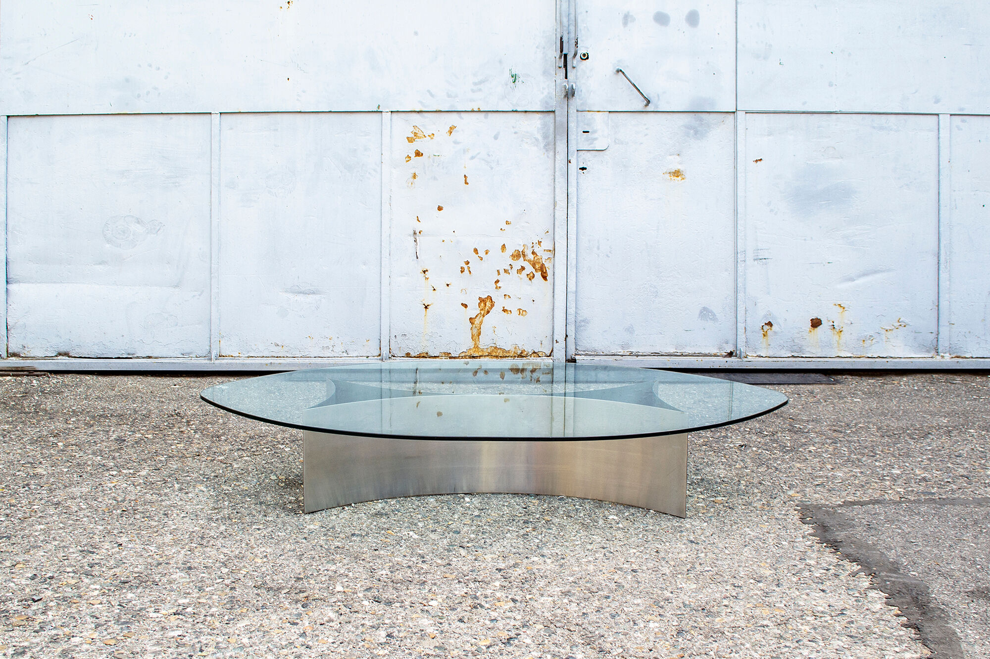 Brutalist coffee table with steel base and 70s glass top