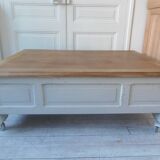 Coffee table on casters, made from an old desk, pearl gray base and belt.