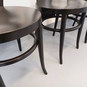 Set of 4 vintage Mouette chairs by Baumann in black wood from the 1960s.
