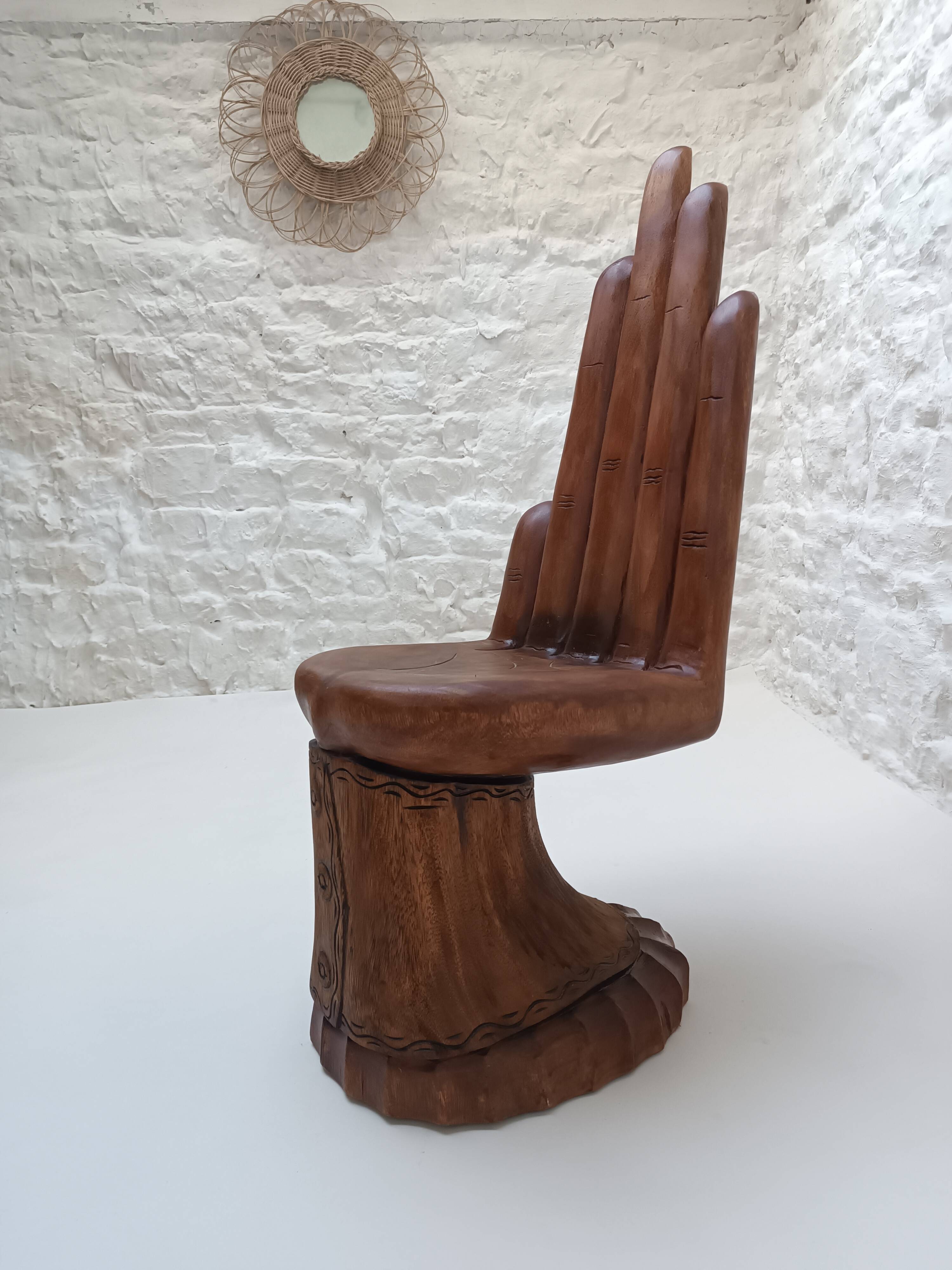 Sculpted wooden chair in the shape of a hand, 1960.