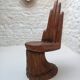 Sculpted wooden chair in the shape of a hand, 1960.