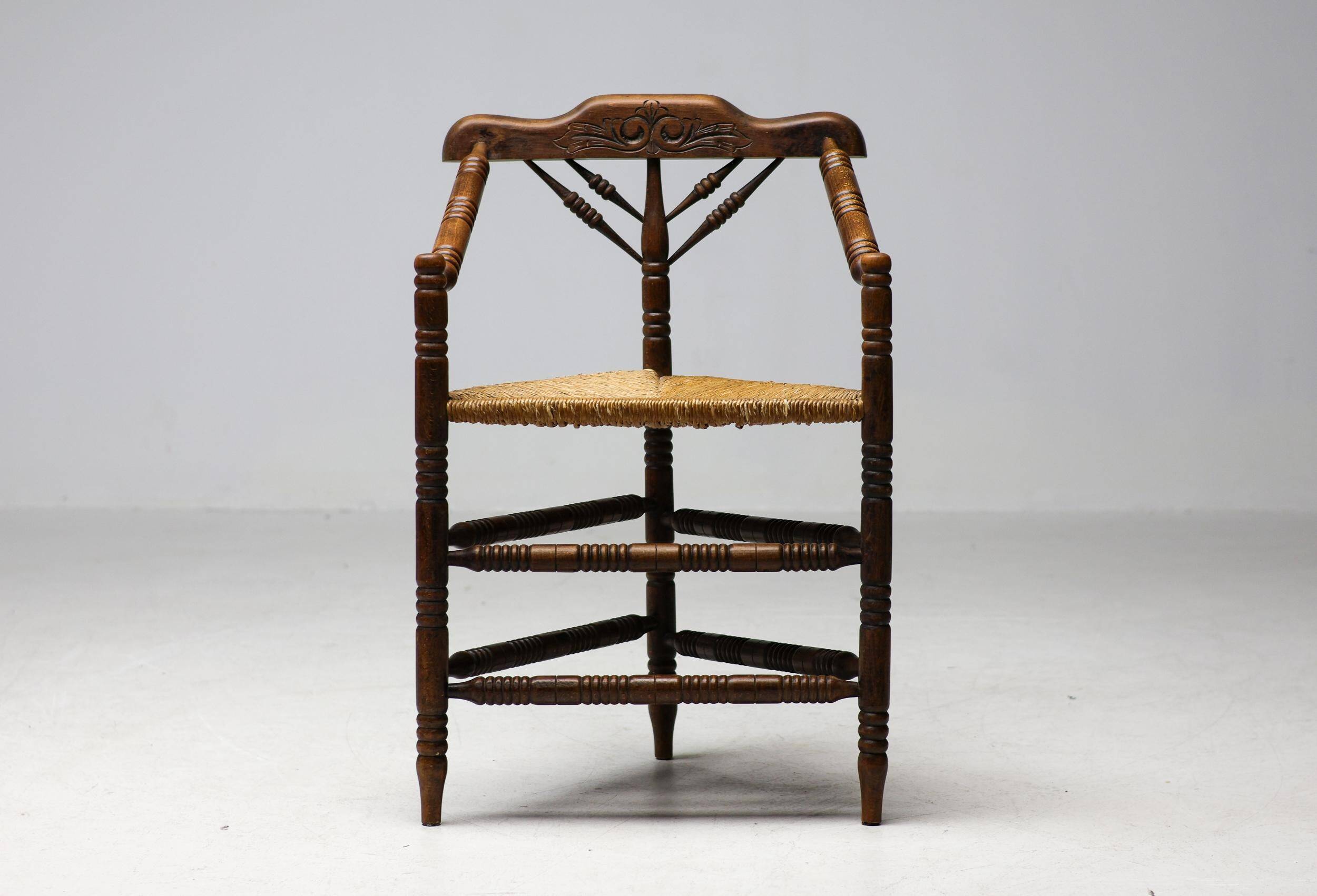 Mid Century Antiques spindle wood chaise with a rush seat.