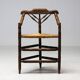 Mid Century Antiques spindle wood chaise with a rush seat.