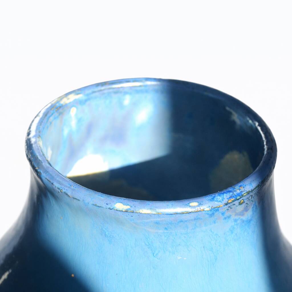 Baluster vase in Belgian ceramic with flowing blue and yellow glazes.