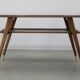 Mid-century German coffee table with rattan shelf and brass legs