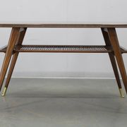 Mid-century German coffee table with rattan shelf and brass legs