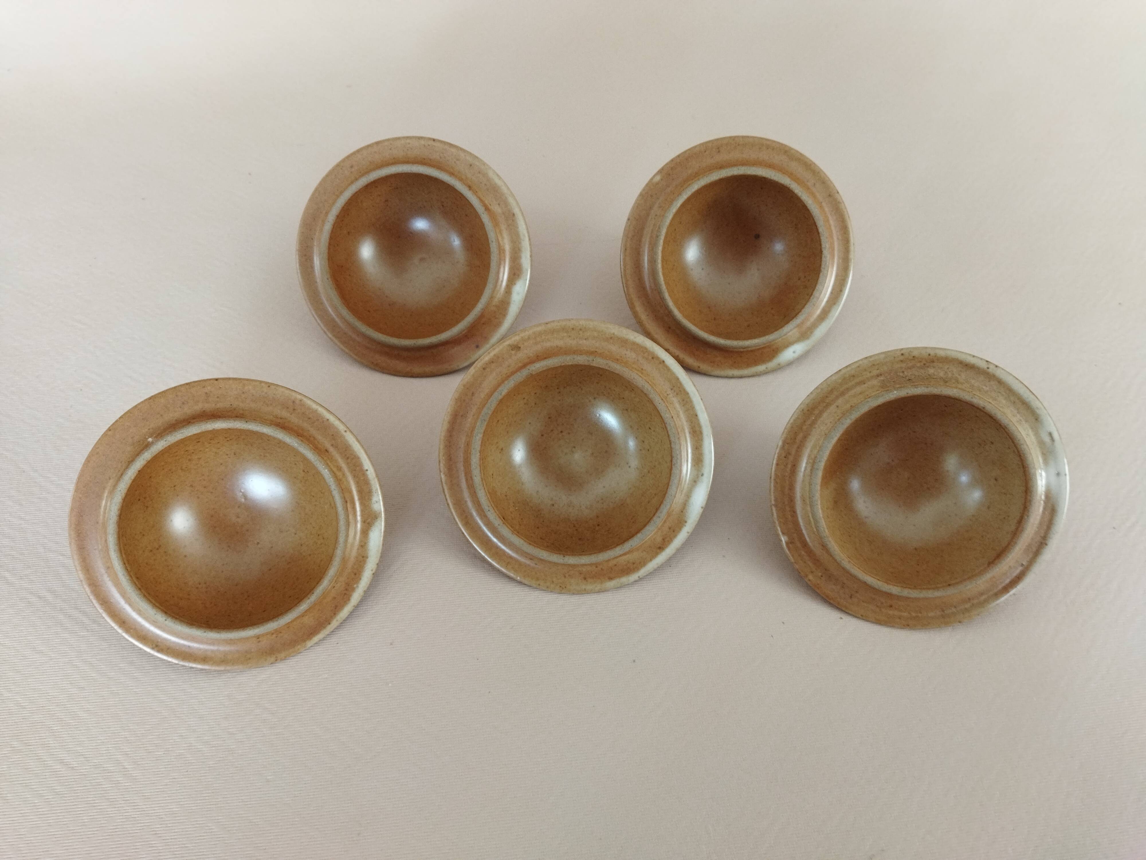 Covered tea bowls in CNP Village sandstone