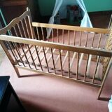 Wooden children's bed with sliding partition.
