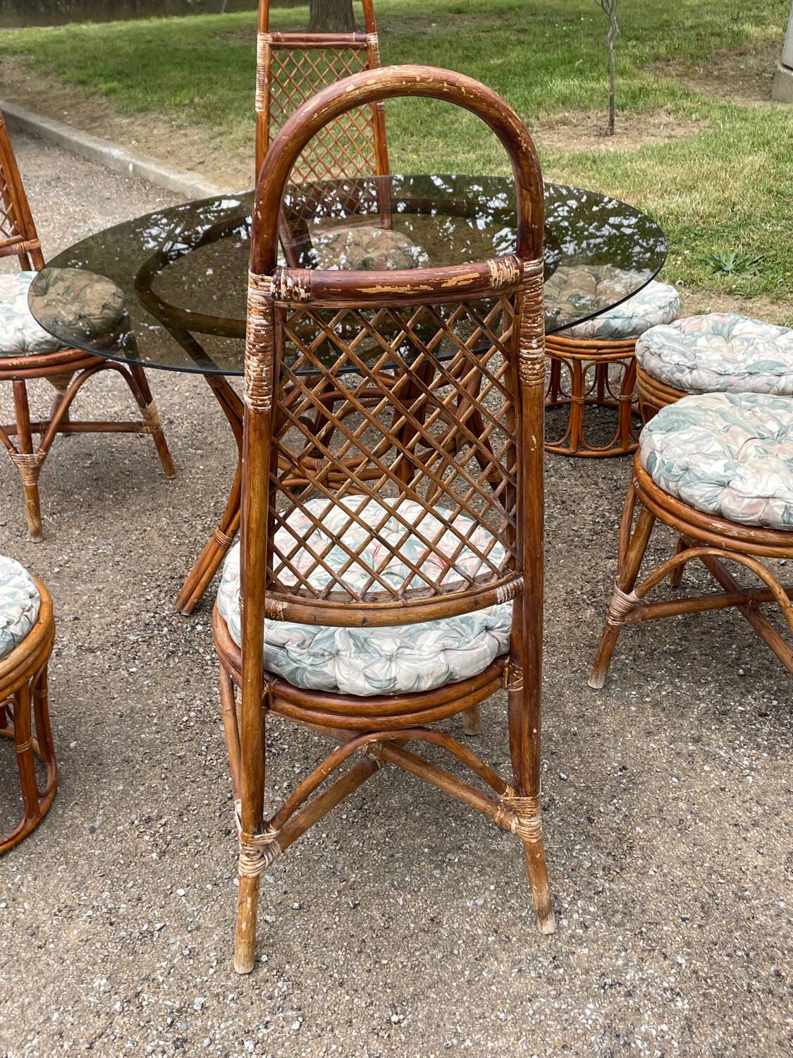 Vintage rattan dining set with glass table, 4 chairs and 4 stools.