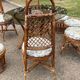 Vintage rattan dining set with glass table, 4 chairs and 4 stools.