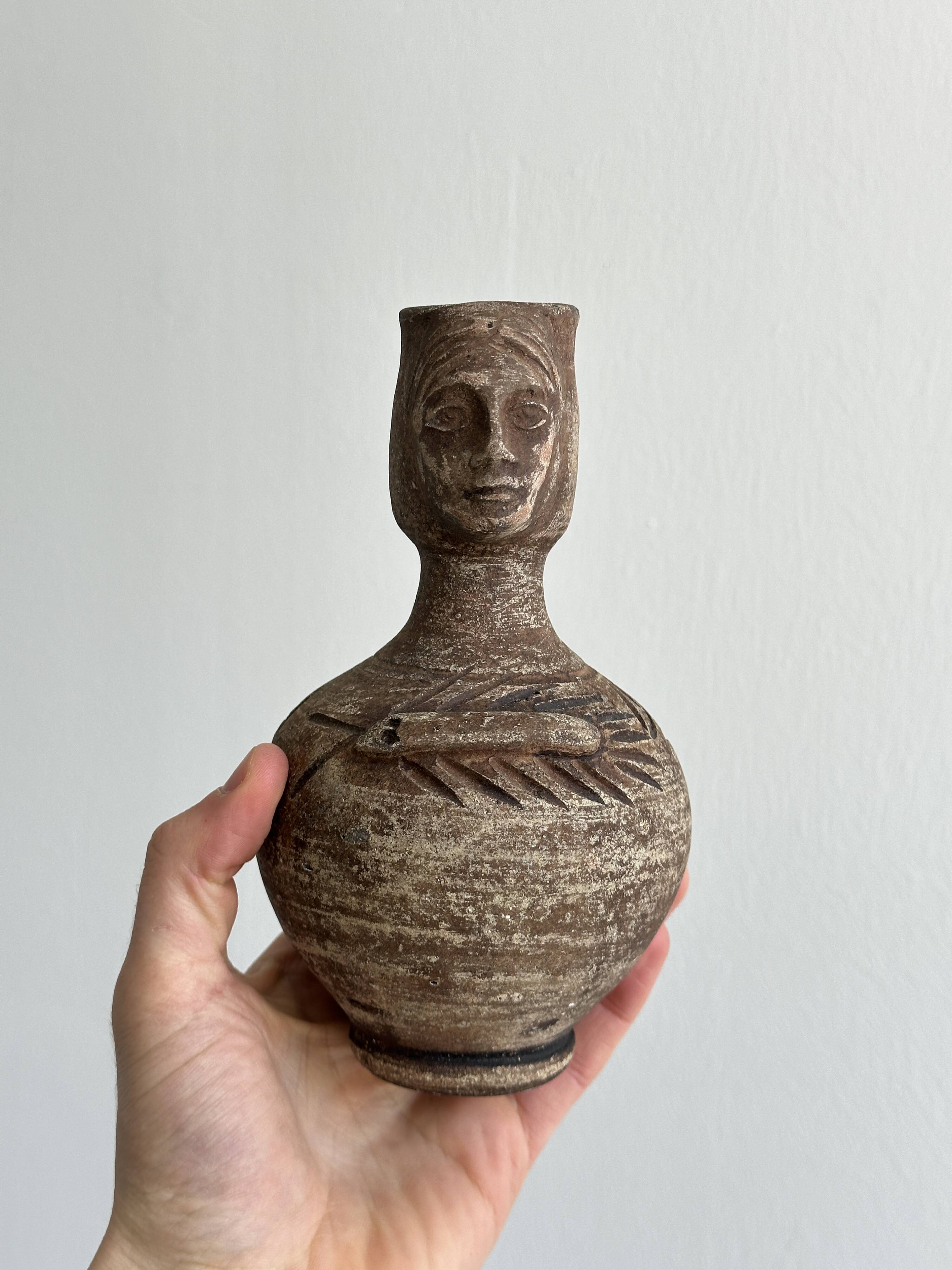 Decorative vase in raw terracotta