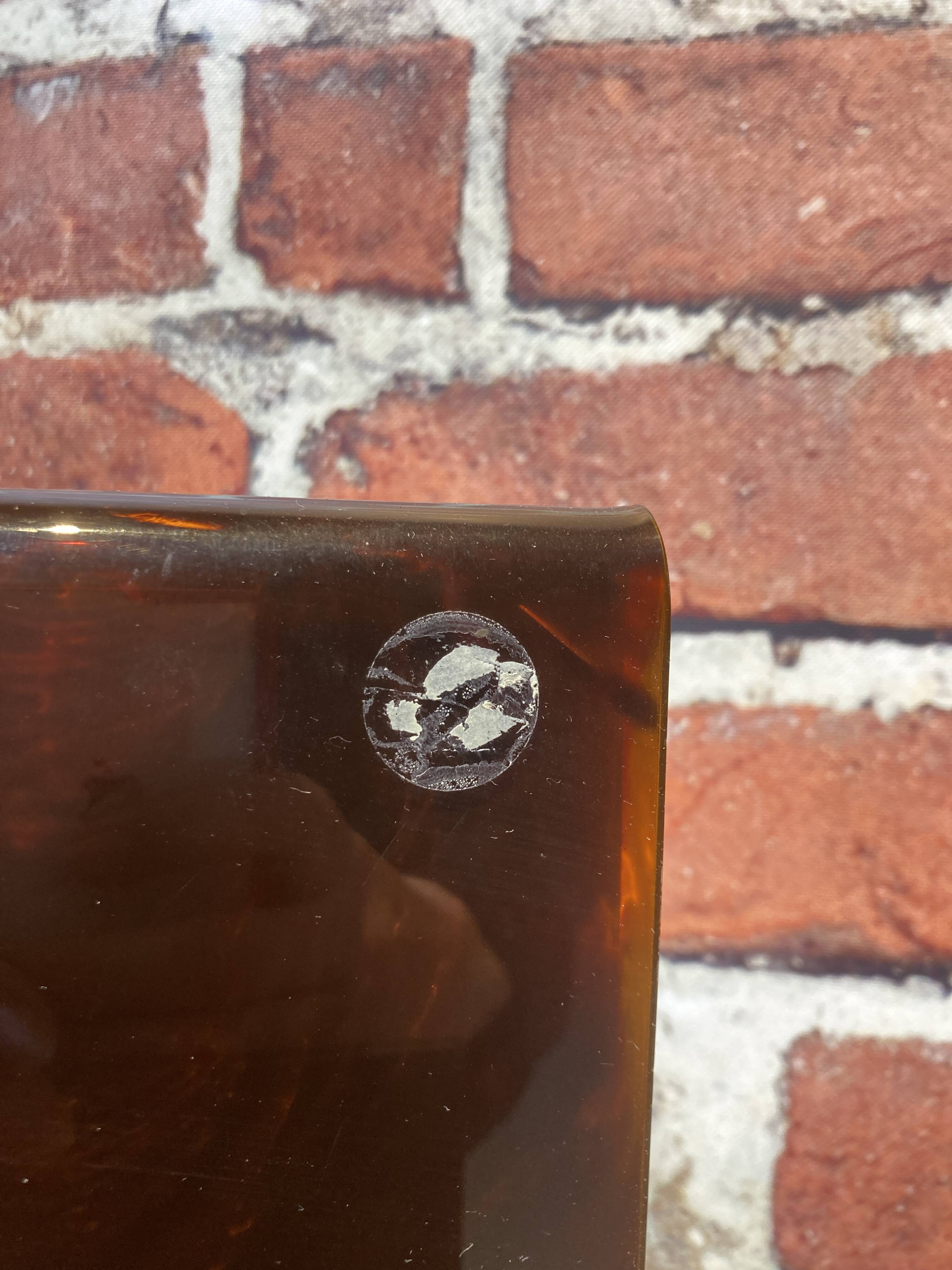 Brown plastic magazine holder with handle