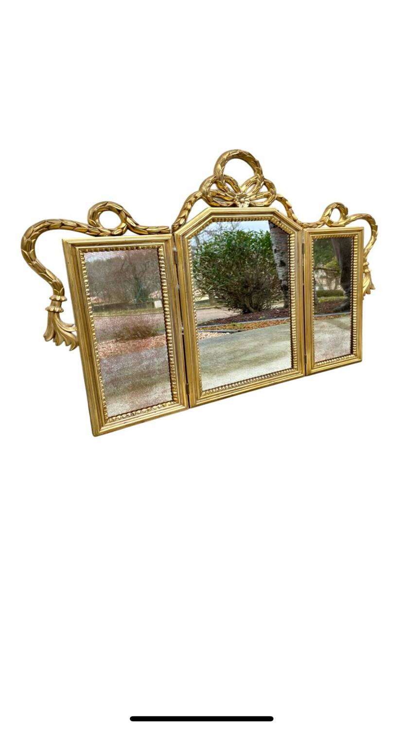 Miroir triptyque en bois doré et sculpté