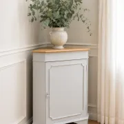 Vintage English corner cabinet enhanced in pearl grey, wooden top.