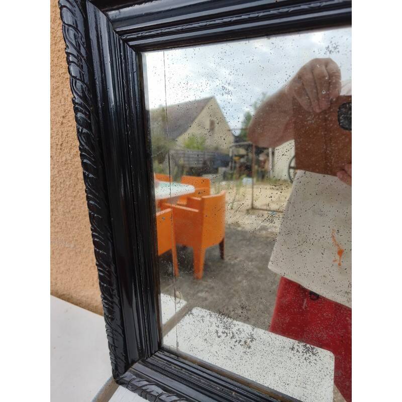 Black lacquered wood mirror "originally punctured"