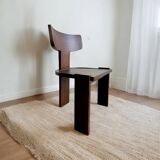 Retro brutalist chair in dark solid wood