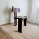 Retro brutalist chair in dark solid wood