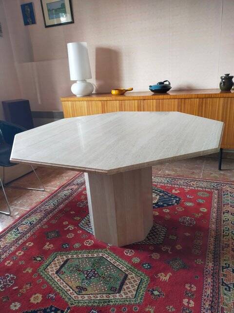 Octagonal dining table in travertine