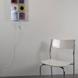 Modernist chair in chrome metal and white laminate, 1960s style.