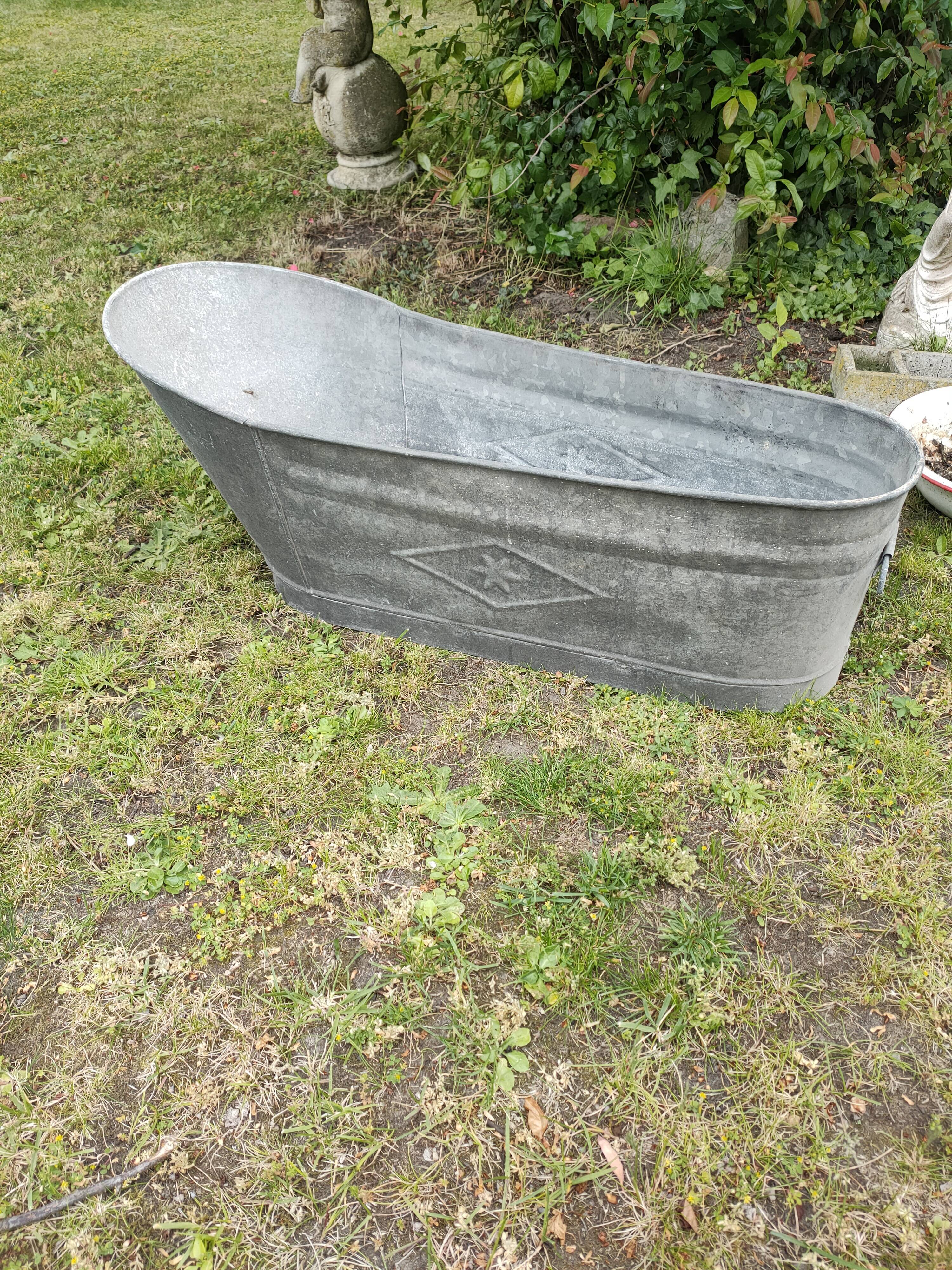 Antique children's bathtub in zinc