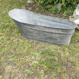 Antique children's bathtub in zinc