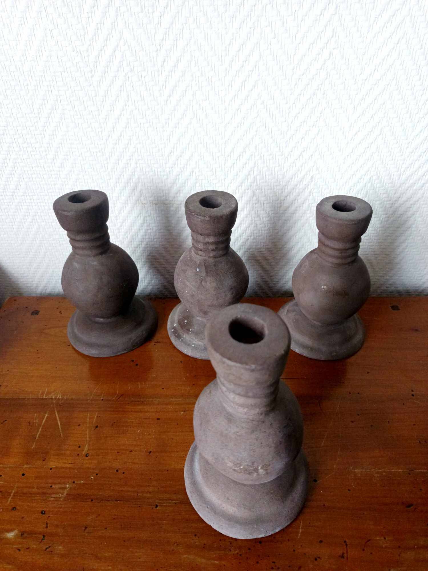 Four vintage handcrafted candle holders