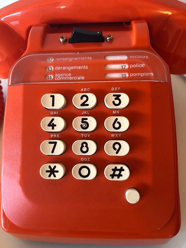 Orange Socotel phone with keys from the 70s 80s