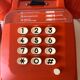 Orange Socotel phone with keys from the 70s 80s