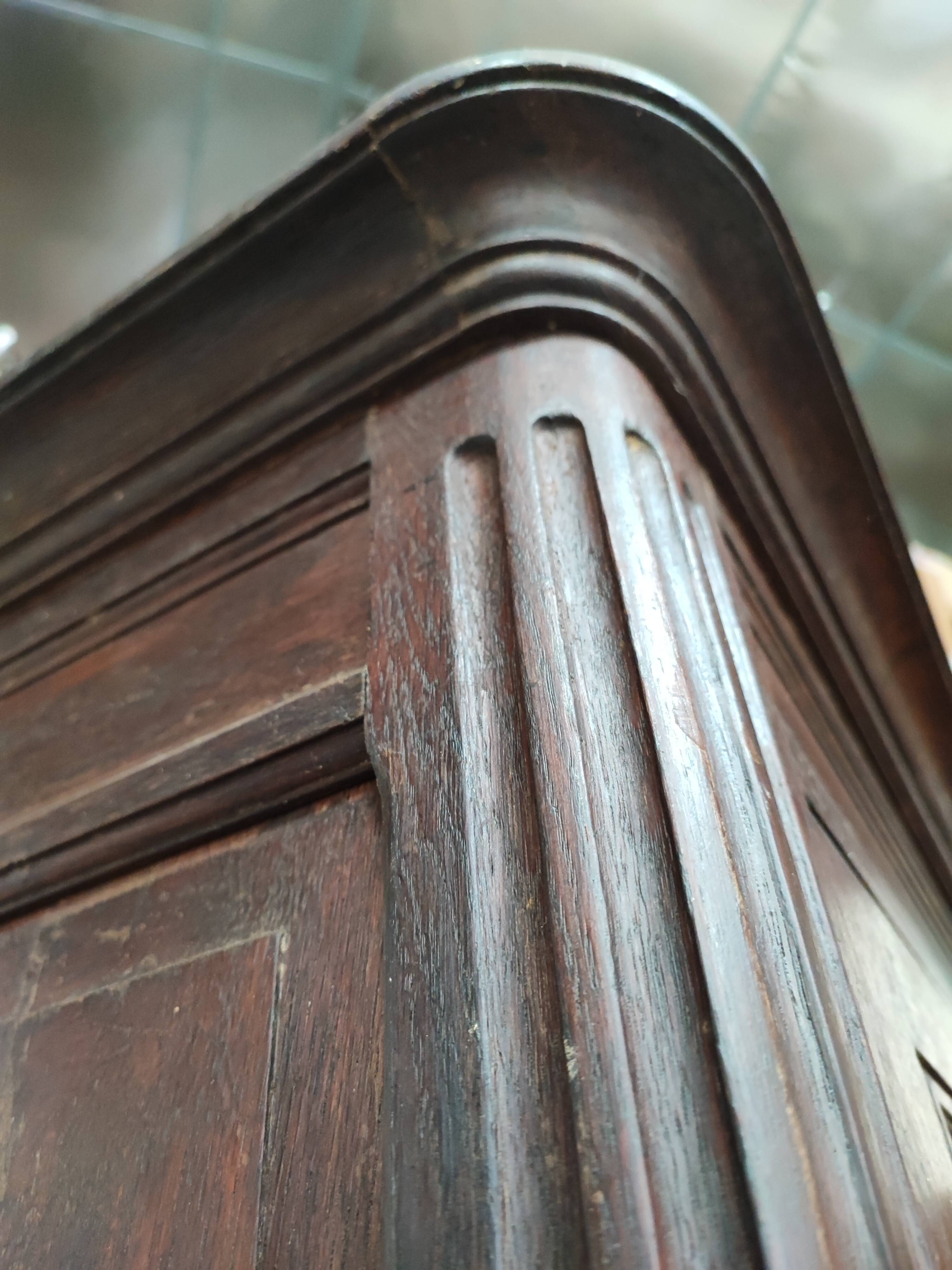 Bonnetière man standing cabinet a door