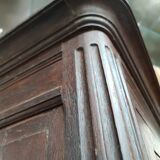 Bonnetière man standing cabinet a door