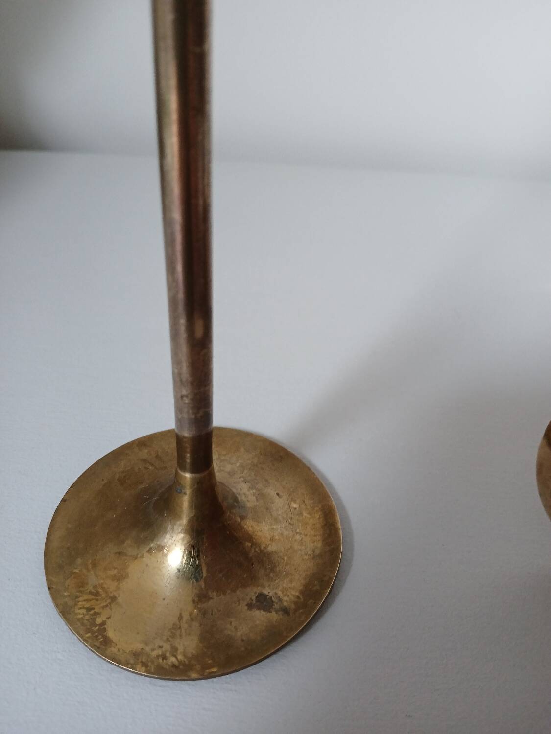 Set of two straight brass candlesticks.