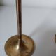 Set of two straight brass candlesticks.