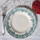 Old mismatched flat plates in iron earth earthenware accompanied by a dish