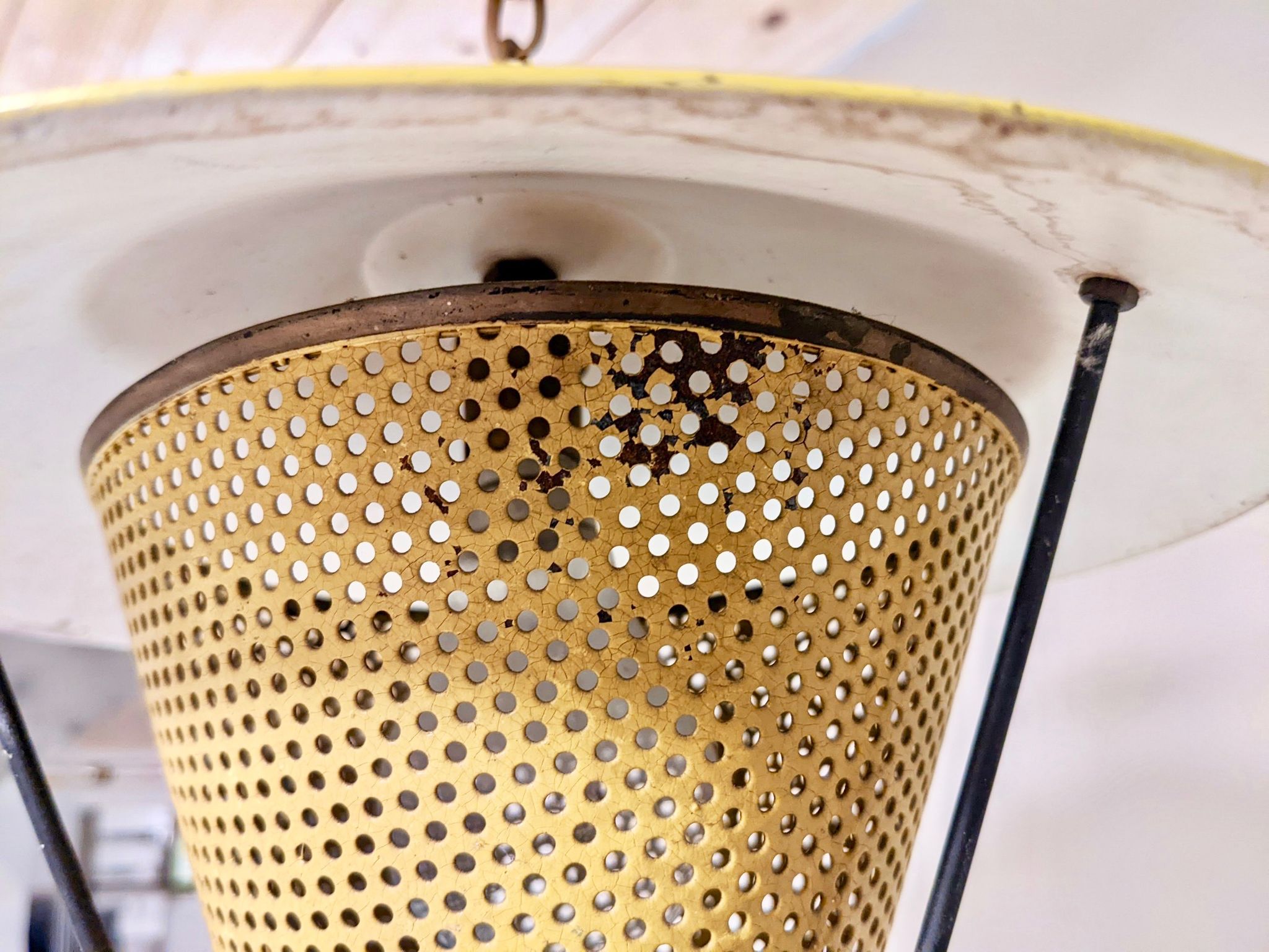 Suspension in perforated sheet metal