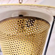 Suspension in perforated sheet metal