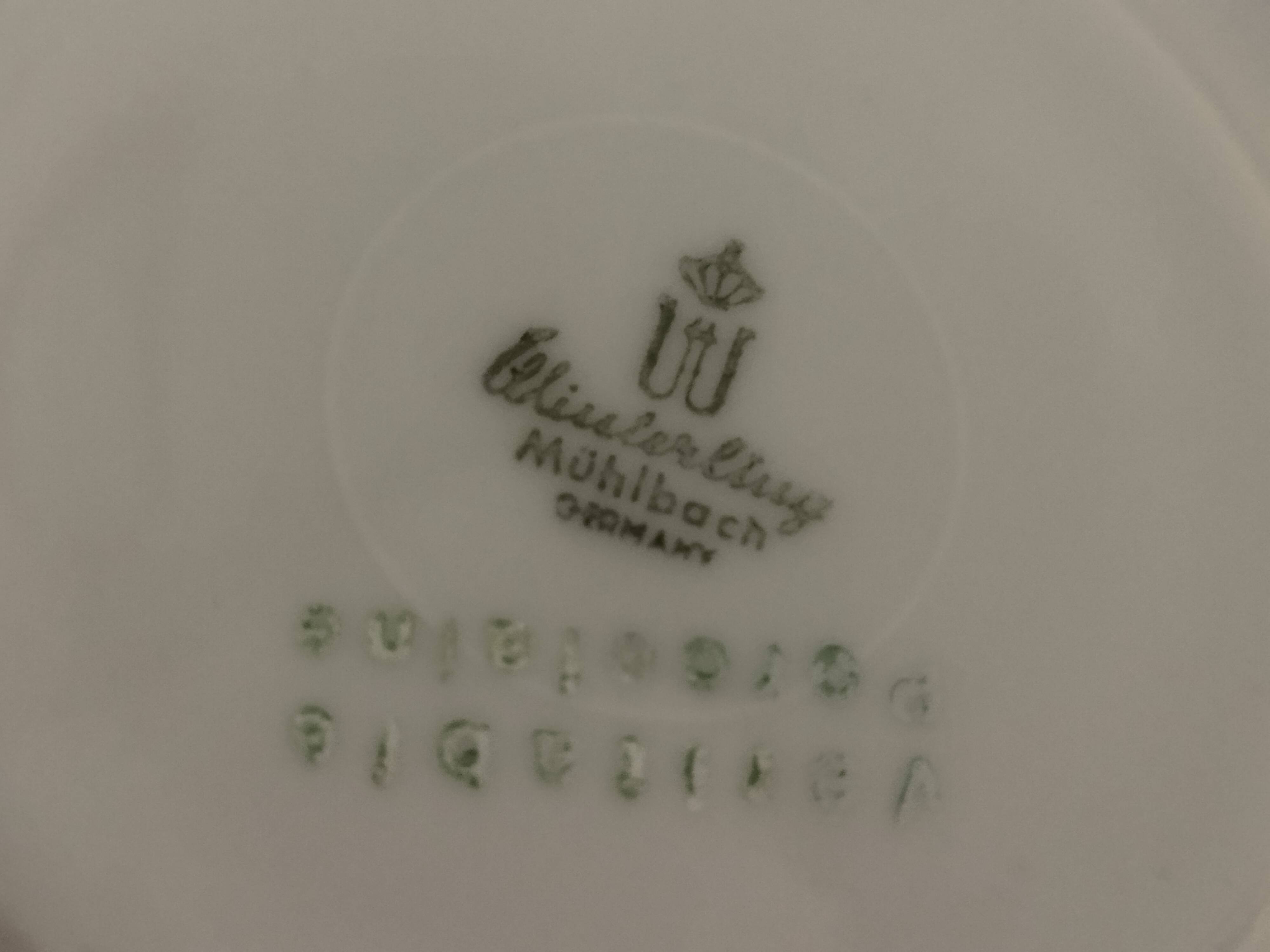 Set of 4 white and gold porcelain cups