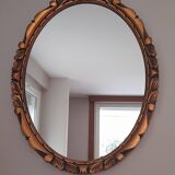 Miroir mural ovale en bois doré