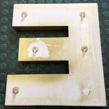 Golden sign letter E