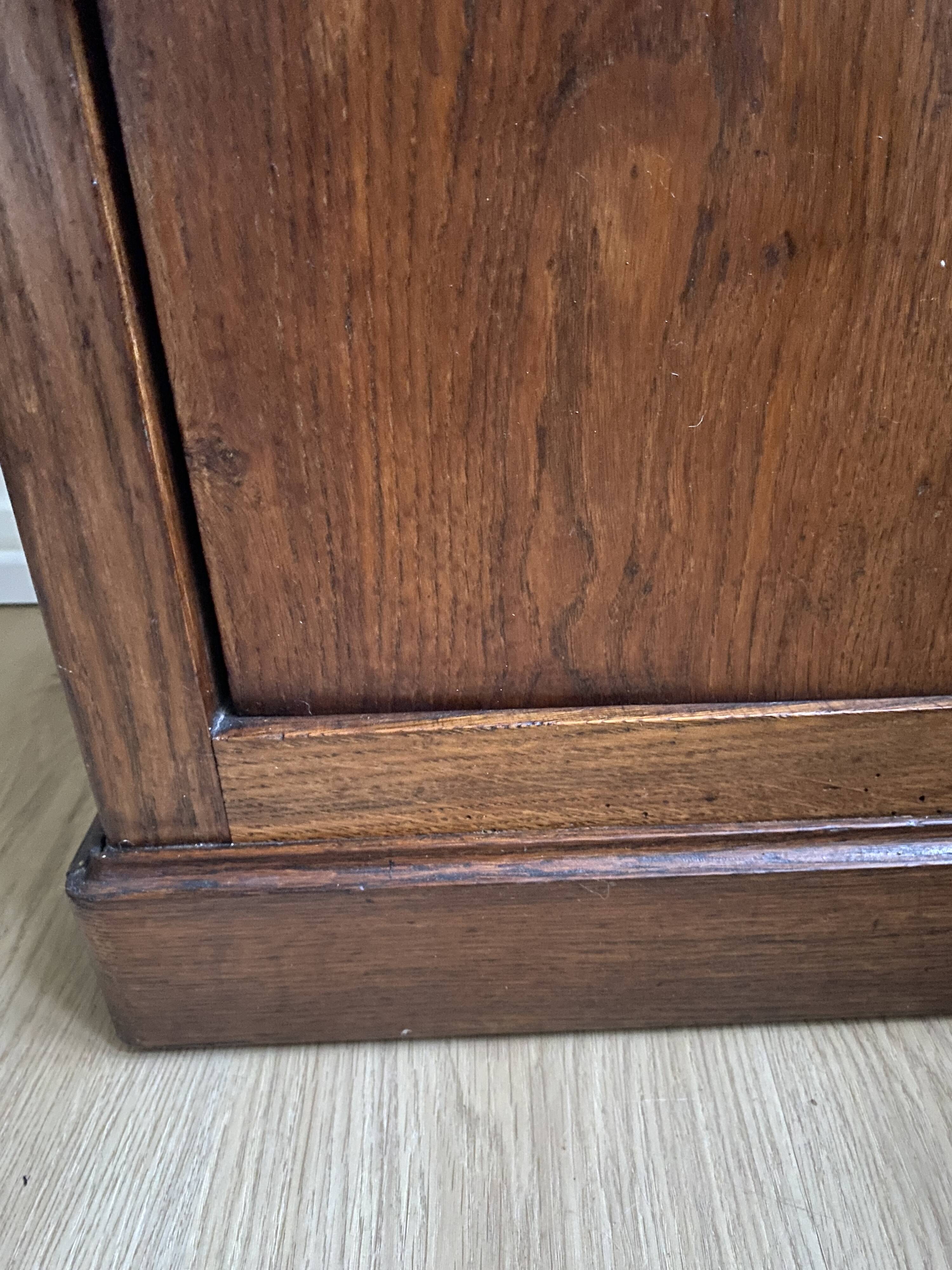 Vintage bedside table in the shape of a wooden column and a gray marble top