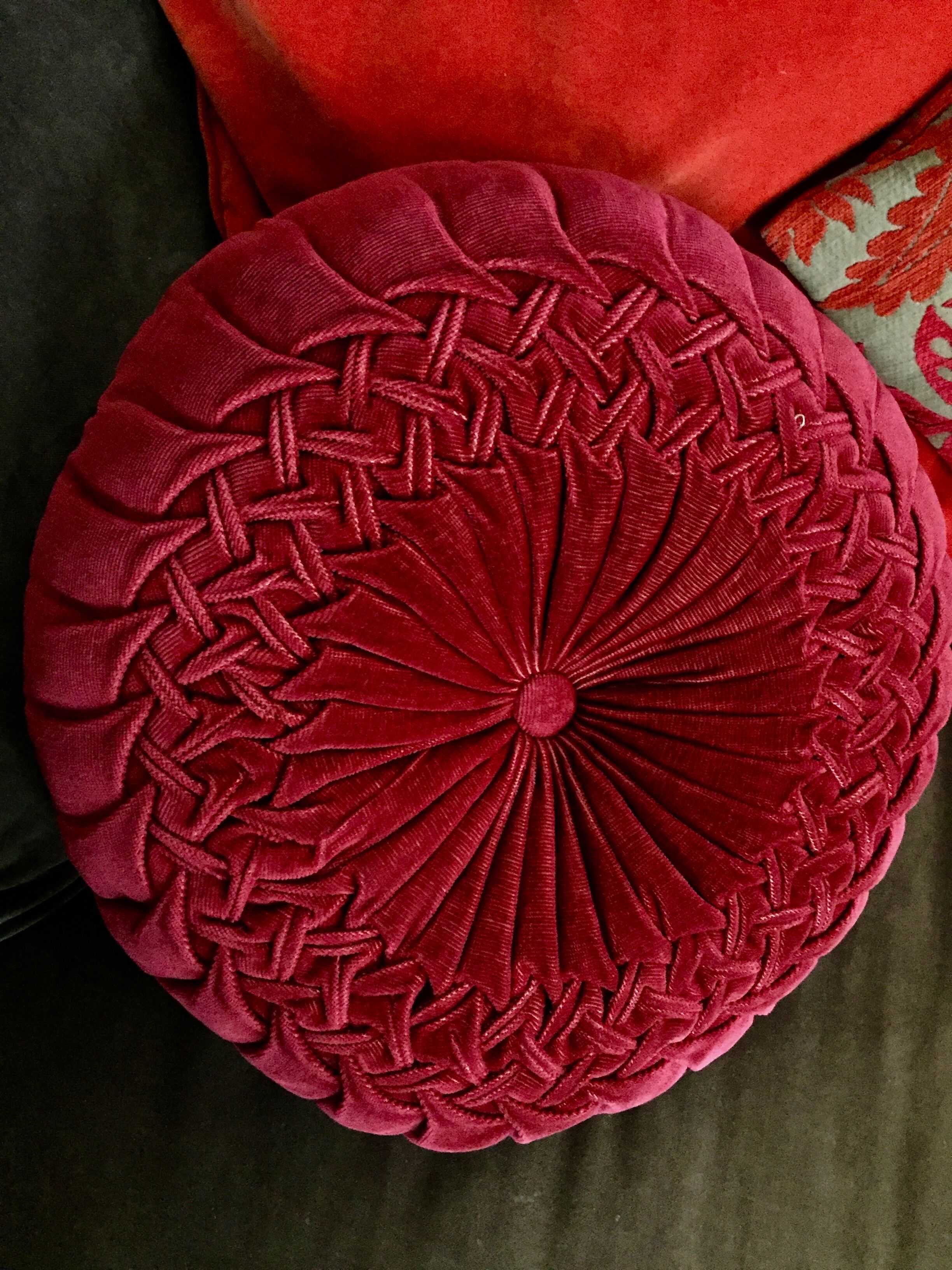 Red braided velvet cushion