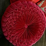 Red braided velvet cushion