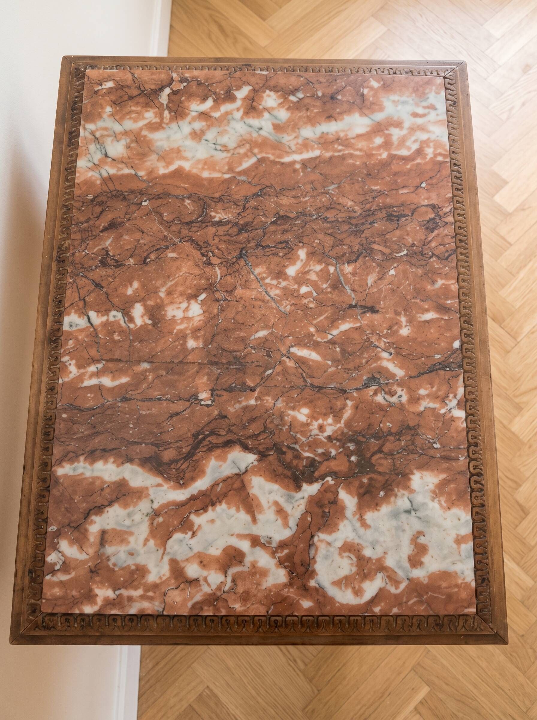 Classic wooden console with veined marble top.