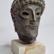Head of Zeus in patinated plaster in imitation of bronze, 15 cm