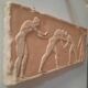 Bas-relief in the antique style featuring athletes.