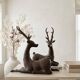 Solid bronze deer 20kg (1979), with period sales certificate.