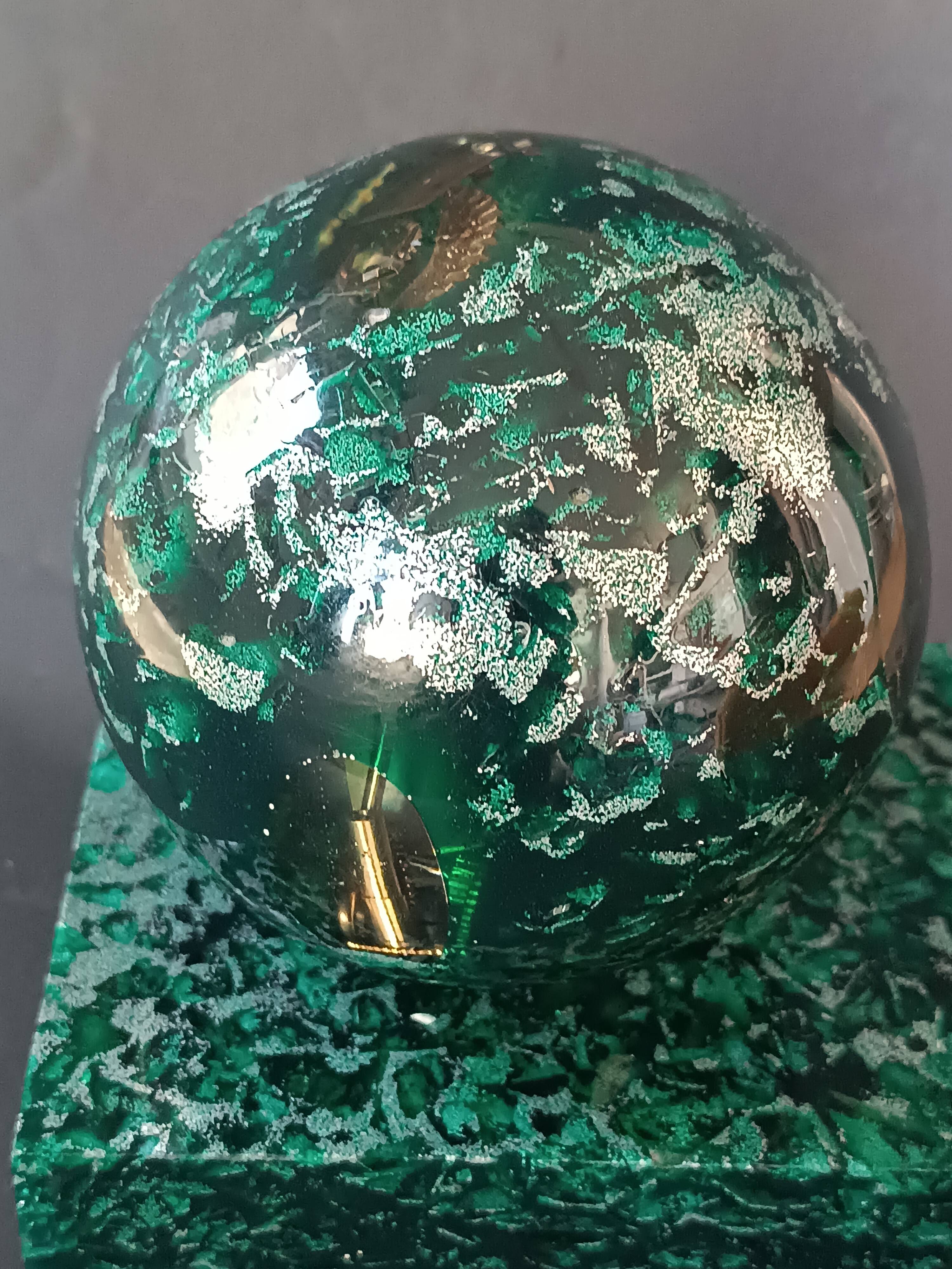 Design bookends in fractal resin with watchmaking inclusions.