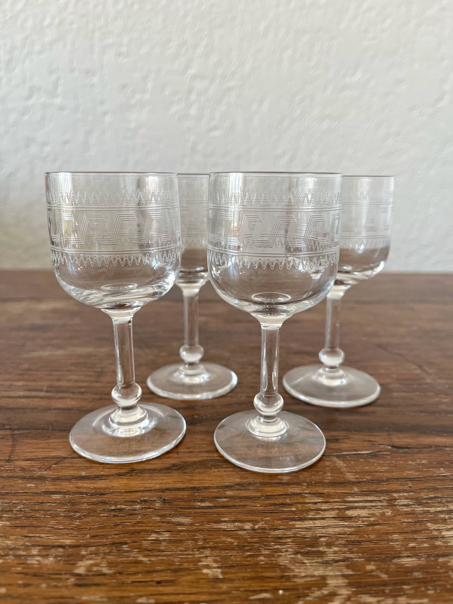 Four antique stemmed liqueur glasses in engraved crystal, 19th century