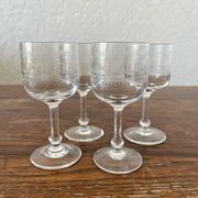 Four antique stemmed liqueur glasses in engraved crystal, 19th century