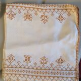 Damask tablecloth with golden patterns